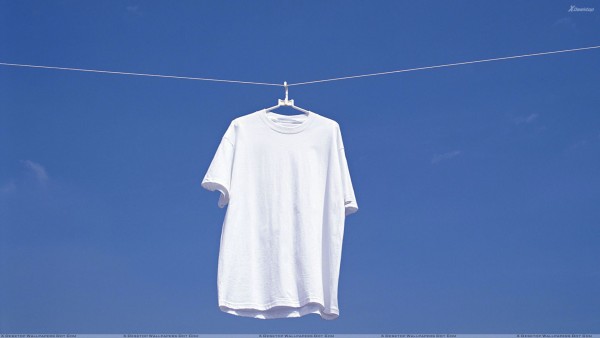 White T Shirt Hanging N Blue Background