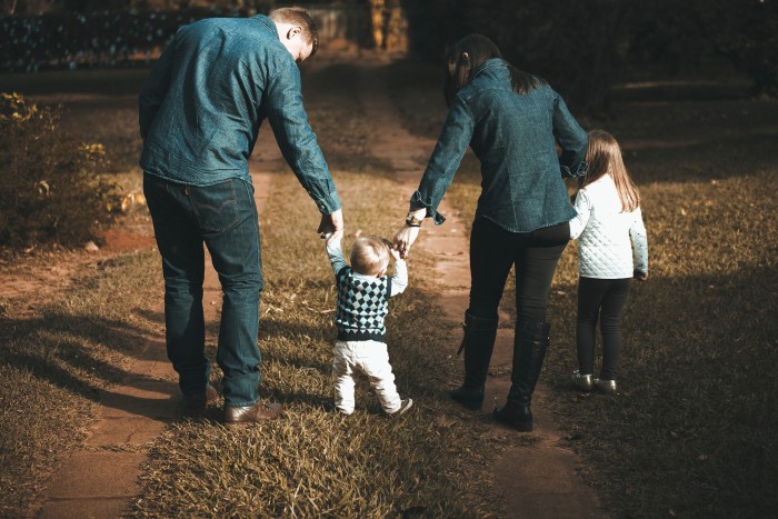 family walking on path 1682497