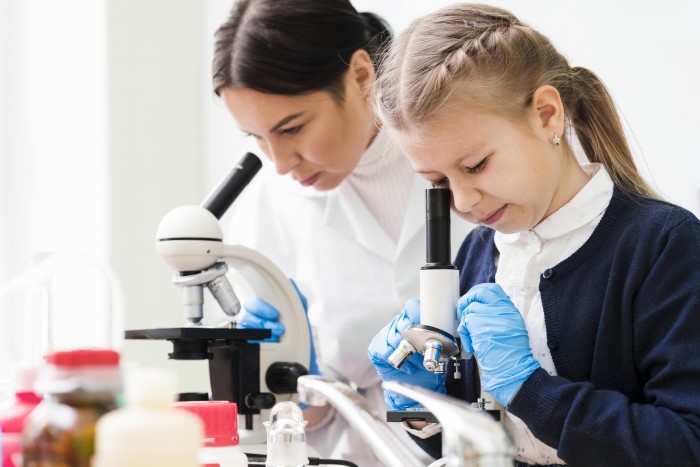 woman girl with microscopes