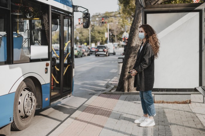 side view woman waiting bus 2