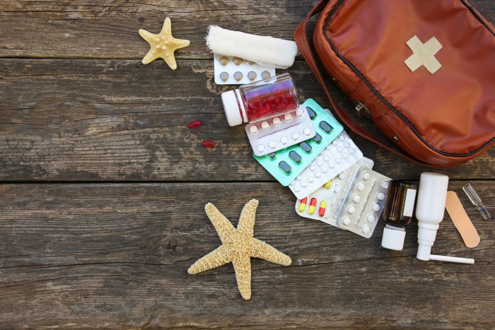 first aid kit old wooden background 1