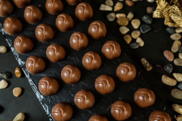 chocolate balls black board paper seastones side view