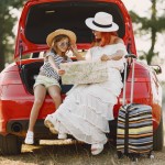 little girl ready go vacations mother with daughter examining map traveling by car with kids
